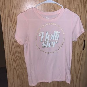Light pink, Hollister t-shirt with white and gold lettering